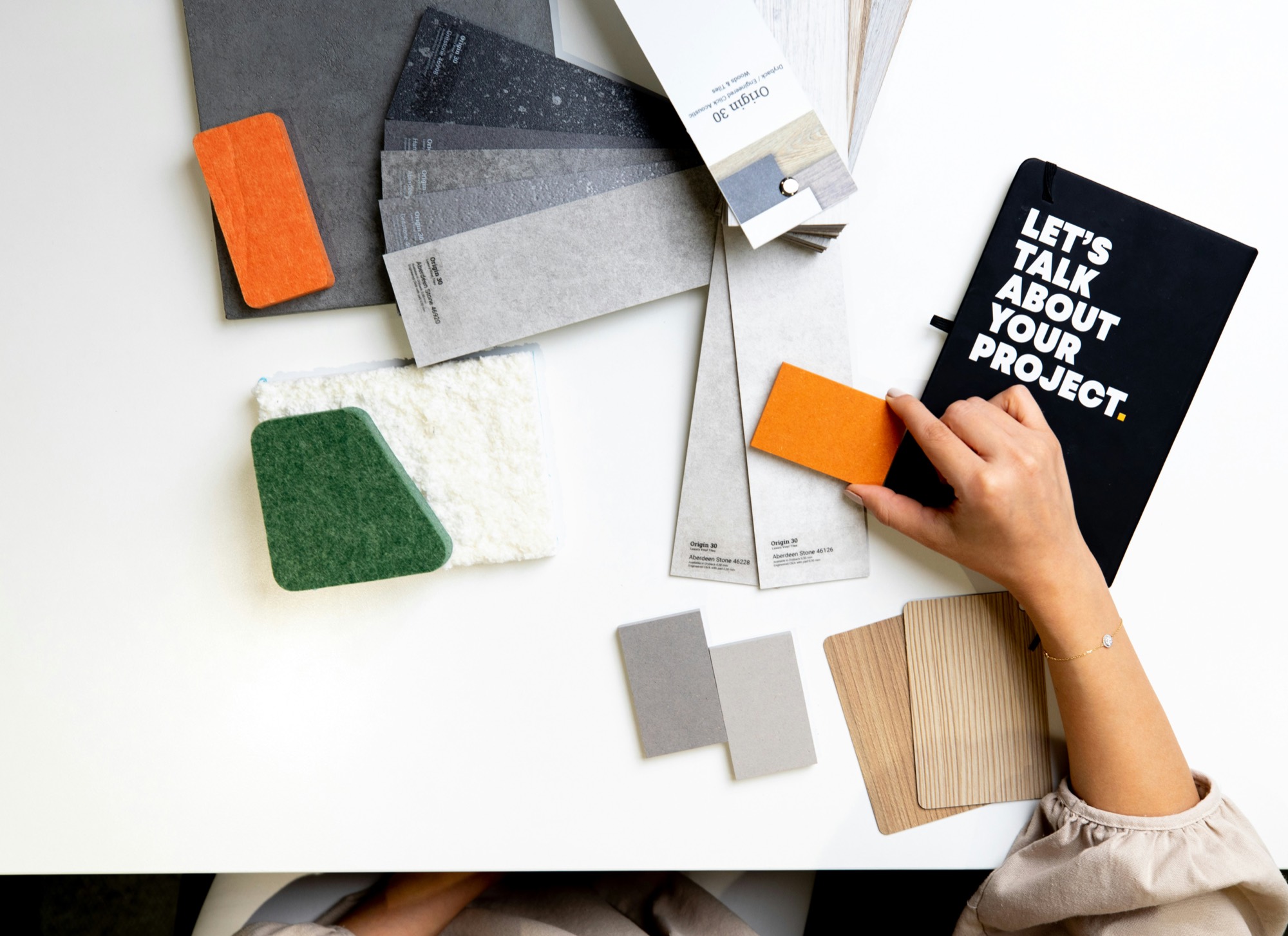 Sustainable interior material samples arranged on a design studio table