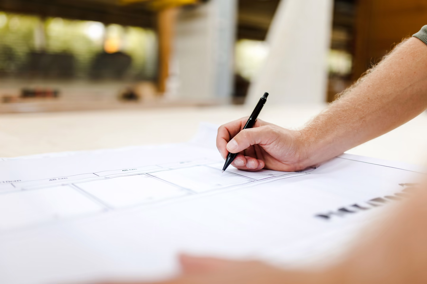 Architect reviewing plans during the spatial design process